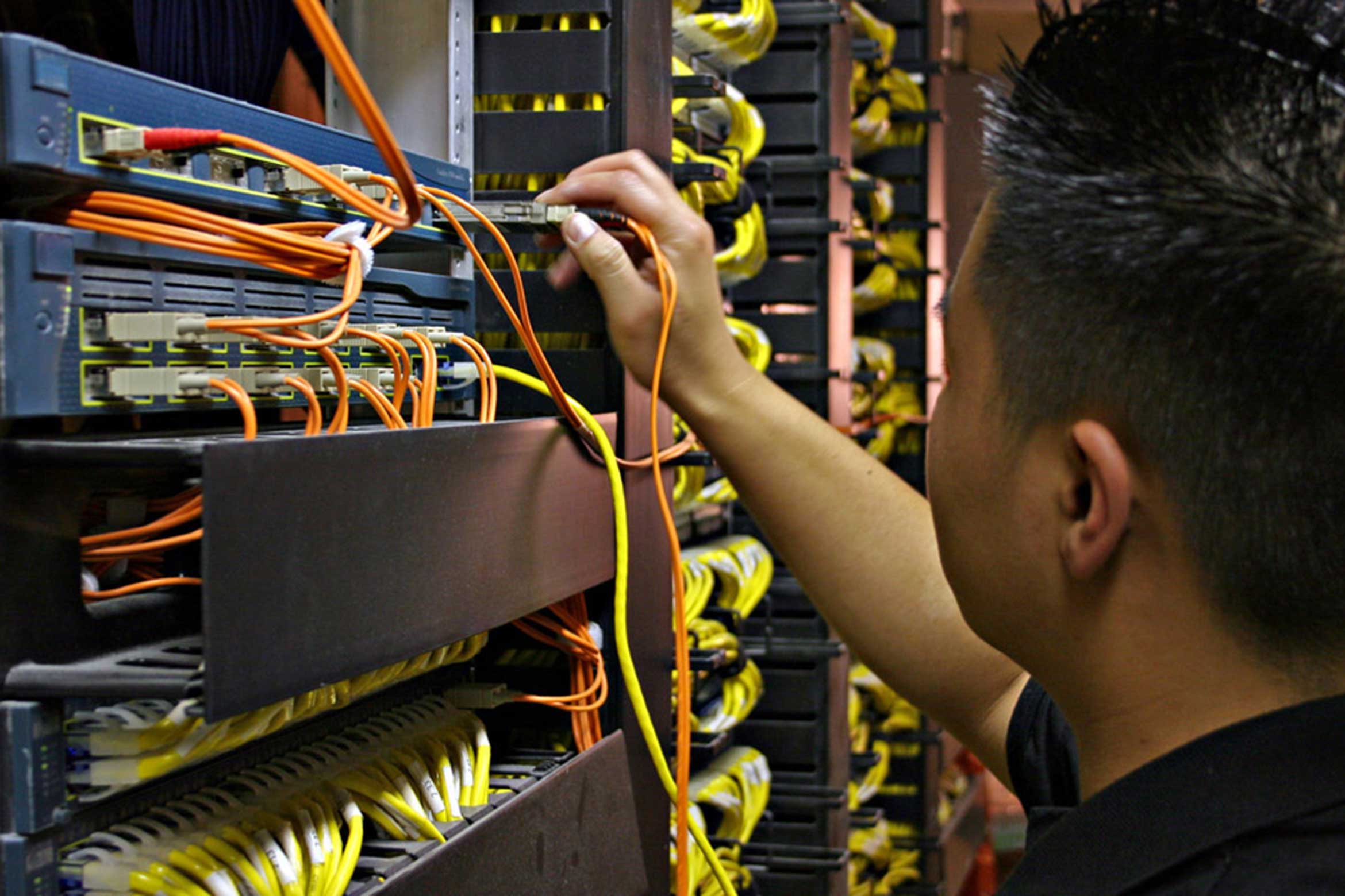 person adjusting server plug ins
