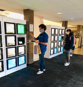 a student pickup their food order from the locker