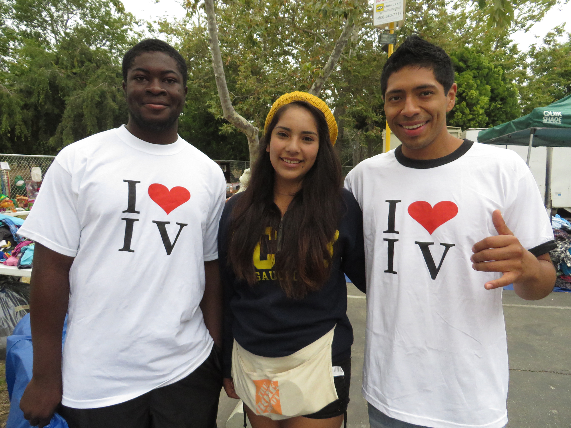 Volunteers Manny, Jasmine, and Adam at Project GIVE