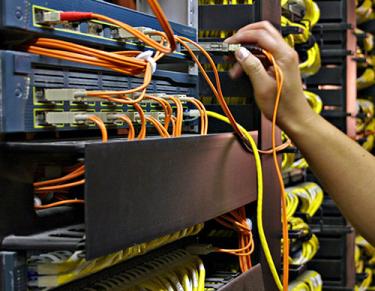 ARIT staff member working in the server room