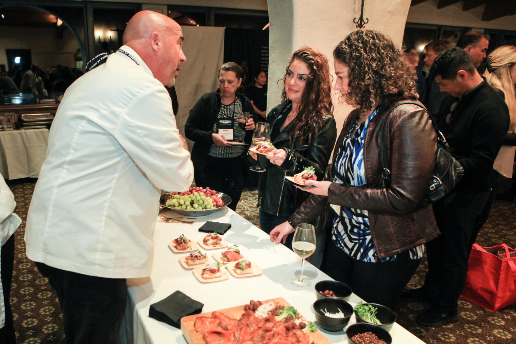 Executive Chef Brian Smith speaking with conference attendees